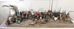 lot 405 image: Large Lot of Thumb Press Oil Cans & More