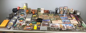 lot 429 image: Lot of Collectibles - Vintage Post Cards - Vintage Glasses - Small Calendars from 1946 - Lighters - Danbury Clock - Smokey the Bear Patches - Camel Patches and More