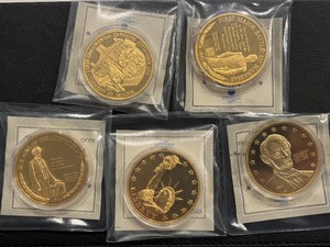 lot 99 image: Gold Plated Medallions