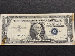 lot 81 image: 1957 A Blue Seal $1 Dollar Silver Certificate Star Note