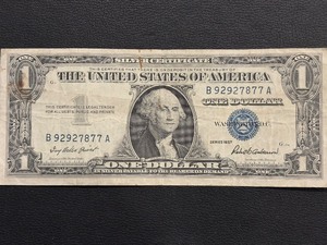 lot 60 image: 1957 Blue Seal $1 Dollar Silver Certificate