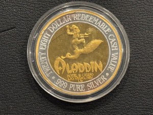 lot 62 image: Aladdin .999 Fine Silver and 24K Gold $28 Dollar Gaming Token