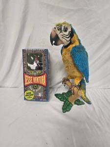 lot 119 image: Jesse Ventura doll and talking parrot