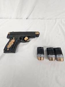 lot 173 image: Pistol Decanter and shot glasses