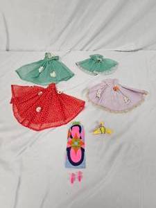lot 206 image: Vintage Barbie Clothes and hangers