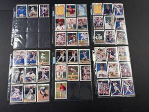 lot 87 image: Collection of Vintage Baseball Cards Featuring Ken Griffey Jr., Jim Thome, and More