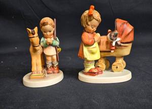 lot 55 image: Goebel Hummel Collectible Figurines - Boy with Horse & Girl with Pram (Set of 2)