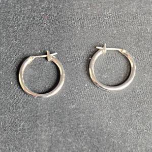 lot 99 image: Pair of Silver Tone Hoop Earrings