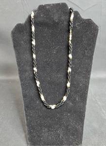 lot 104 image: Elegant Black Beaded Necklace with Gold Accents