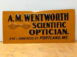 lot 174 image: Original Antique Embossed Tin A.M. Wentworth Scientific Optician Advertising Sign
