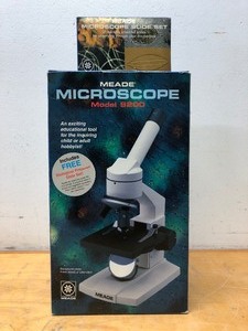 lot 244 image: Brand New MEADE Microscope & Slide Set