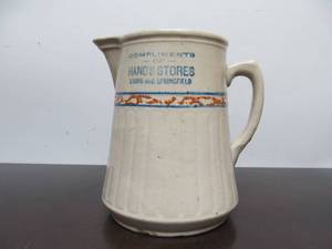 lot 24 image: Vintage RED WING Stoneware Advertising Pitcher - Hands Stores - Lyon & Springfield