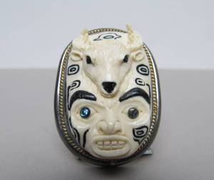 lot 35 image: Carved Bone & Sterling Silver Inuit Style Brooch Pendant wCarved Face & Deer