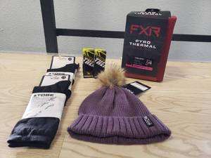 lot 214 image: FXR Pyro Thermal Longsleeve top Womens Medium Black, FXR Sonic Beanie Muted Grape, 3 pairs of Tobe Primus Merino socks and 2 Castle Thermatex Balaclavas Black