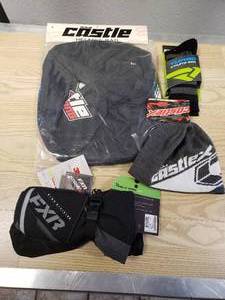 lot 223 image: FXR Helix Race MItts - YOUTH Large, Castle Standard helmet bag black with color logo, FXR SM socks and a Castle beanie