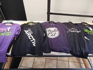 lot 243 image: 5 Womens X-Large t-shirts - 1 long sleeve - some black, some purple - 4 Artic Cat and 1 Motorfist