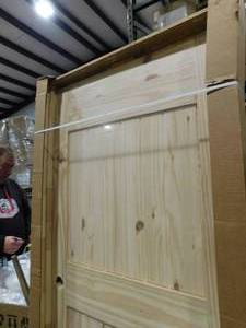 lot 113 image: Jeldwen 2 Panel Knotty Pine Interior Door 32 x 80 Left Hand