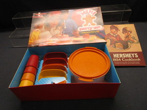 lot 47 image: Tupperware Childrens Party Set, Hershey Cook Book