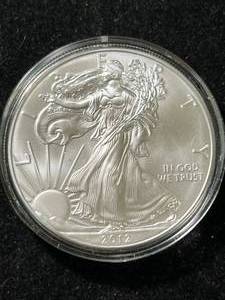 lot 28 image: 2012 AMERICAN SILVER EAGLE 1 TROY OZ .999 FINE SILVER IN AIRTITE