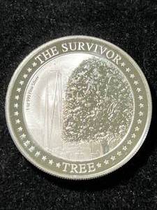 lot 64 image: 2022 SURVIVOR TREE ROUND 1 TROY OZ .999 FINE SILVER