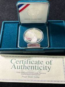 lot 76 image: 1996 NATIONAL COMMUNITY SERVICE COMMEM PROOF SILVER DOLLAR