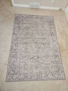 lot 64 image: Elegant Area Rug with Distressed Styling