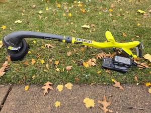 lot 144 image: Ryobi Cordless String Trimmer - P20003