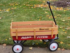 lot 142 image: Radio Flyer Traveler Red Wagon with Wood Guard Rails