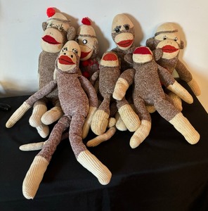 lot 243 image: Seven Sweet Sock Monkeys