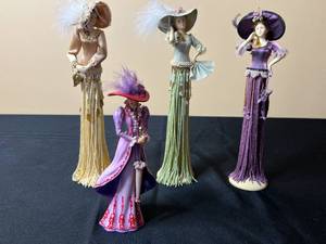 lot 24 image: Thomas Kinkade Tea at Three Figurine & Collection of 3 Elegant Porcelain Figurines w Fringed Skirts on Stands In Historical Fashion