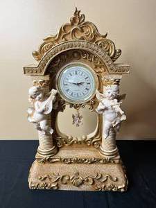 lot 25 image: Vintage Cherub Figure Quartz Clock with Ornate Base