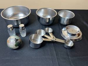 lot 31 image: Collection of Stainless Steel Mixing Bowls and Measuring Cups with Decorative Globe and Salt Shakers