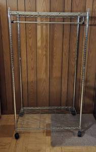 lot 215 image: Commercial Grade Rolling Clothing Rack with Shelf