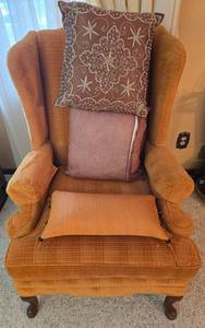 lot 57 image: Vintage Wingback Armchair with Decorative Pillows