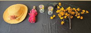 lot 60 image: Set of Decorative Items Including Straw Hat, Umbrella, Solar-Powered Ghost Figurines, and Floral Branch