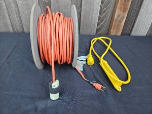 lot 11 image: Heavy-Duty Extension Cord on Reel and Yellow Power Strip