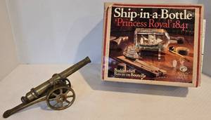 lot 207 image: Vintage Ship-in-a-Bottle Model Kit & Brass Cannon Military Toy