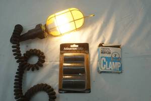 lot 265 image: hanging shop light, radiator hose repair kit, muffler clamps