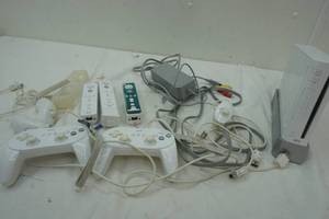 lot 297 image: Nintendo Wii with several controllers, cords, power adapter