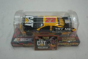 lot 35 image: CAT Nascar diecast car and display base