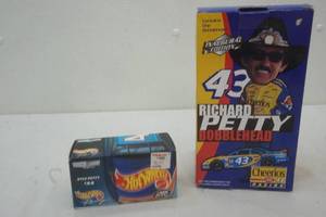 lot 42 image: Richard Petty and Kyle Petty collectibles, die cast car and bobblehead
