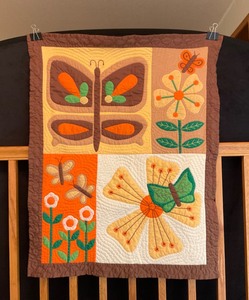 lot 10 image: Quilted Wall ArtHand-Stitched Wall Hanging Lap Quilt Butterflies & Flowers Finished Quilt in Earth Tones