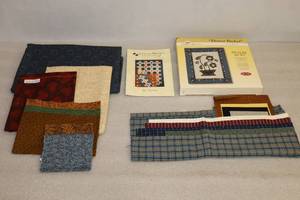 lot 55 image: (2) Quilting Project Kits Tic-Tac-Mo Quilt By Terry Atkinson and Flower Basket Picture Quilt By The Quilt Collection wCoordinating Fabric and Pattern Booklet