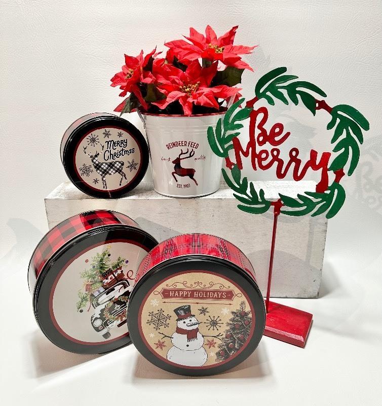 ASSORTED HOLIDAY DECOR including Faux Potted Poinsettia, Tins and BE MERRY Sign
