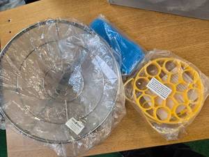 lot 109 image: Lot of 1 Silicone Egg Poachers , 1 Bath Scrubber and one 15W food Filter (All are new)