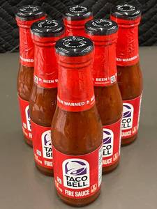 Group of 6 Taco Bell Fire Sauce Bottles - Packaged and Unopened