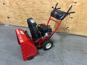 lot 1 image: TROY-BILT STORM 2410 24in Gas Powered Snow Blower Model 31AS6BN2723