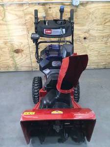 lot 7 image: Toro 24 Two Stage Snow Blower with Two 6Ah Batteries Model # 39925