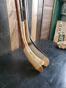lot 15 image: Four Solid Adult Hockey Sticks