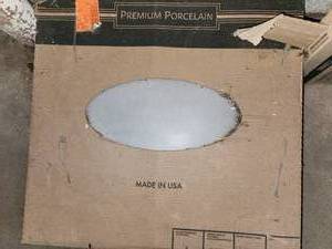 lot 64 image: 4 boxes 24x24 grey porcelain tile